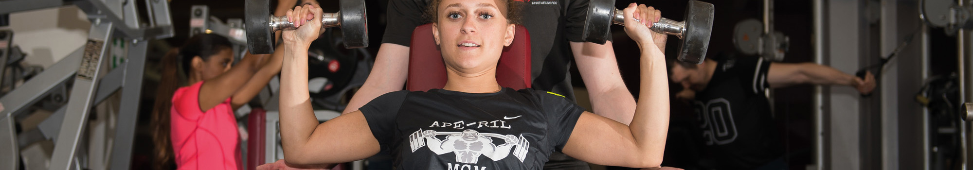 Trainer and customer in gym