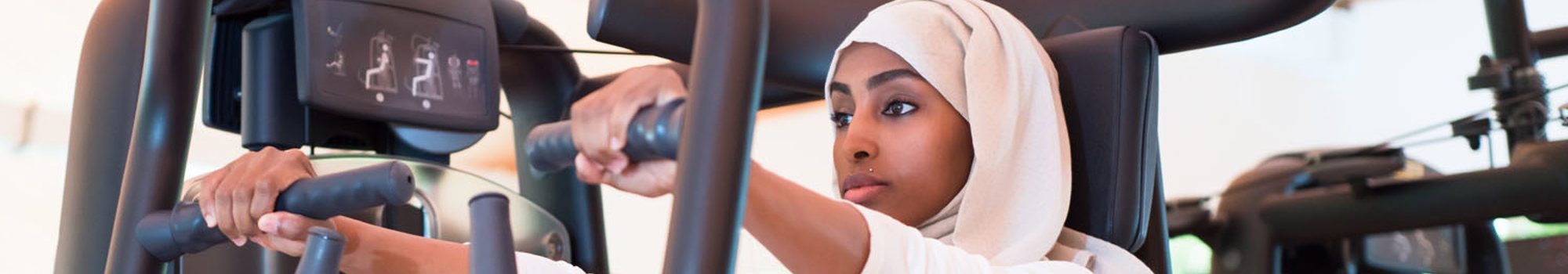 Woman On Gym Machine